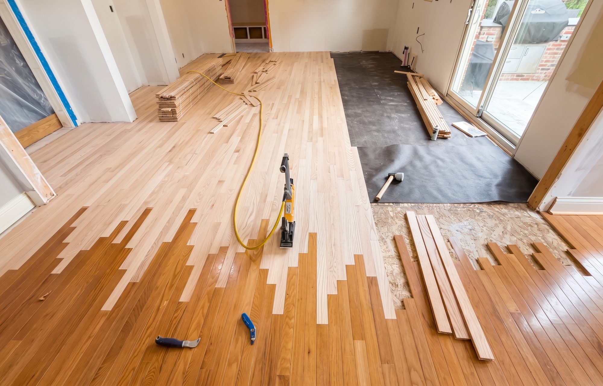 A Brewer Custom Floors crew installing a floor